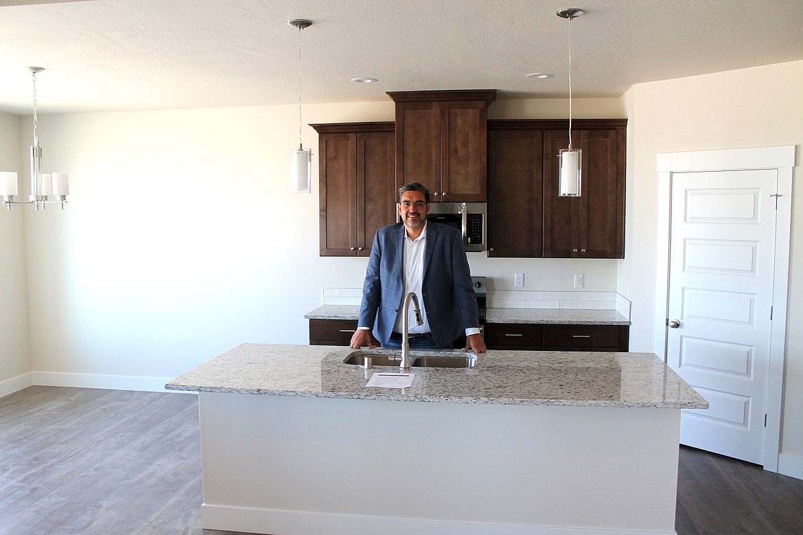 Broker Jessie Dominguez stands in the kitchen of a Palos Verdes home in the Sandhill Estates development in Othello.