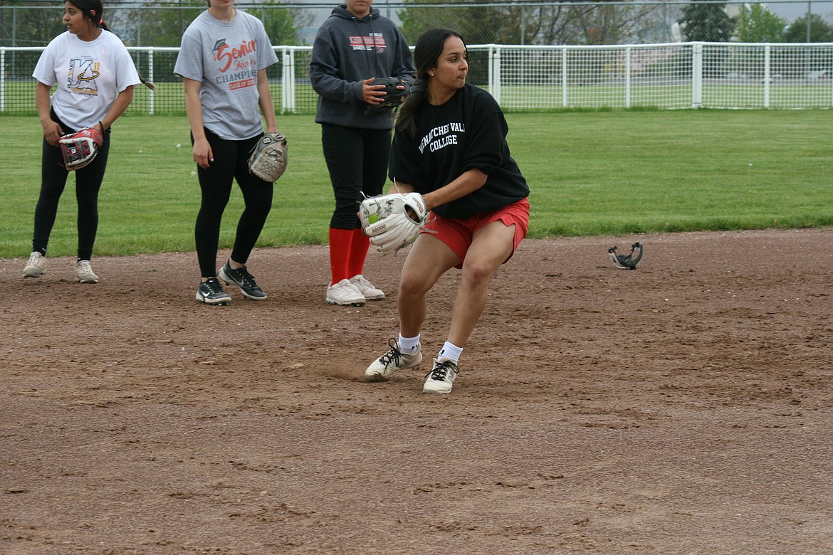 Sophomore Persayis Garza mimics the throw to first during practice. The Othello High School fastpitch softball team opens state tournament play today.