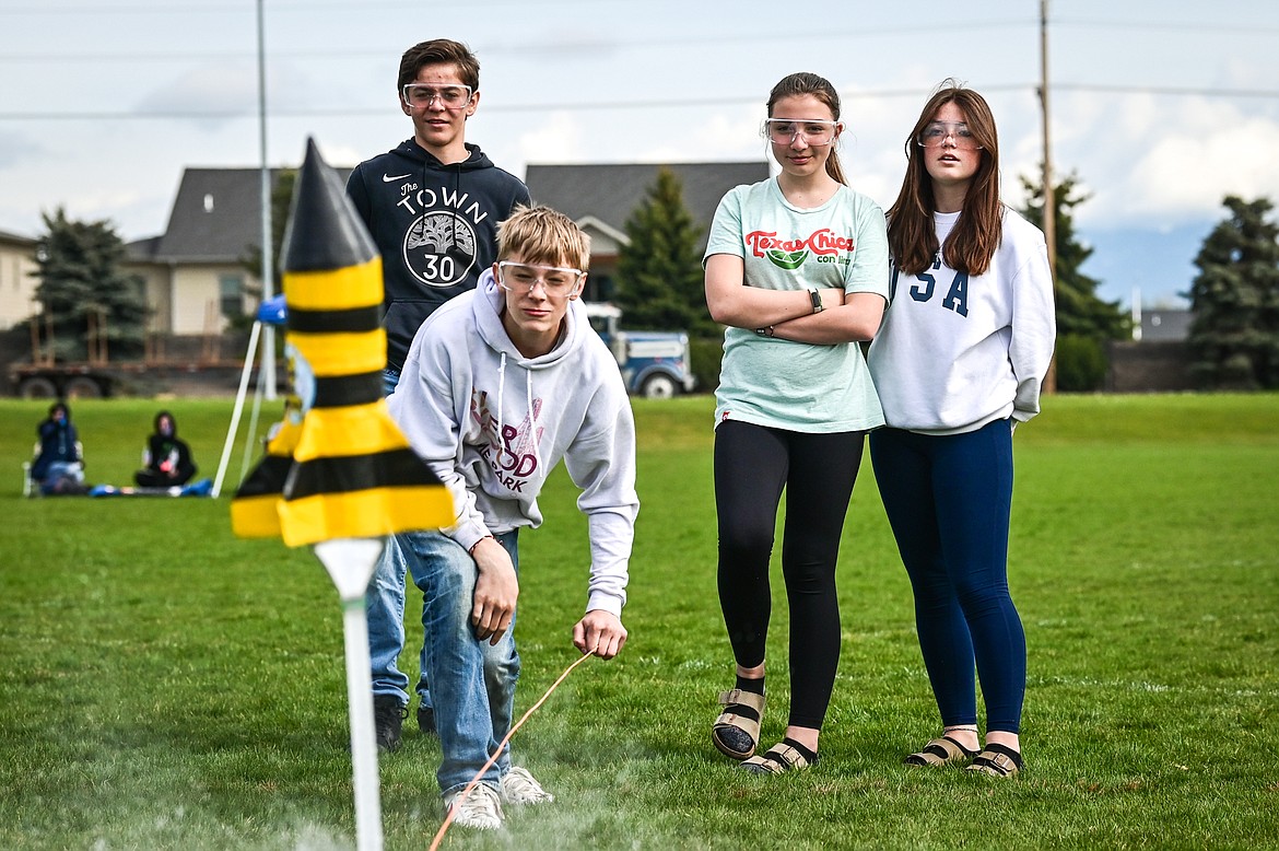 Cayuse Prairie eighth-graders, from back left, Treker Hickey, Zayn Bertram, Madison Young and Riley Frederick launch their water-powered rocket named Bumblebears at the 6th annual Flathead Valley Rocket Rally at Glacier High School on Thursday, May 26. Students first learn the physics of flight and rocket science, then work in teams using the engineering process to design, build, test, analyze and modify their water bottle rockets. (Casey Kreider/Daily Inter Lake)