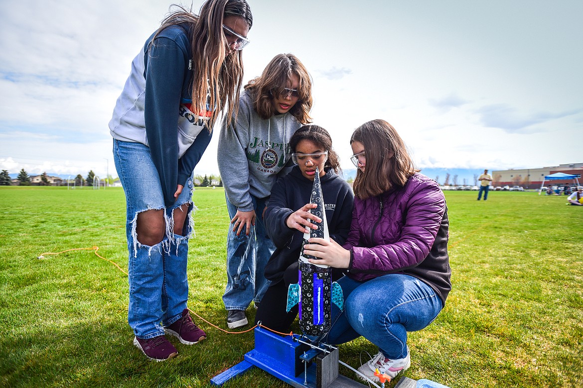 Kila School eighth-graders, from left, Olivia Neva, Cadence Edwards, JC Tillman and Trinity Hogard prepare their water-powered rocket for launch at the 6th annual Flathead Valley Rocket Rally at Glacier High School on Thursday, May 26. Students first learn the physics of flight and rocket science, then work in teams using the engineering process to design, build, test, analyze and modify their water bottle rockets. (Casey Kreider/Daily Inter Lake)