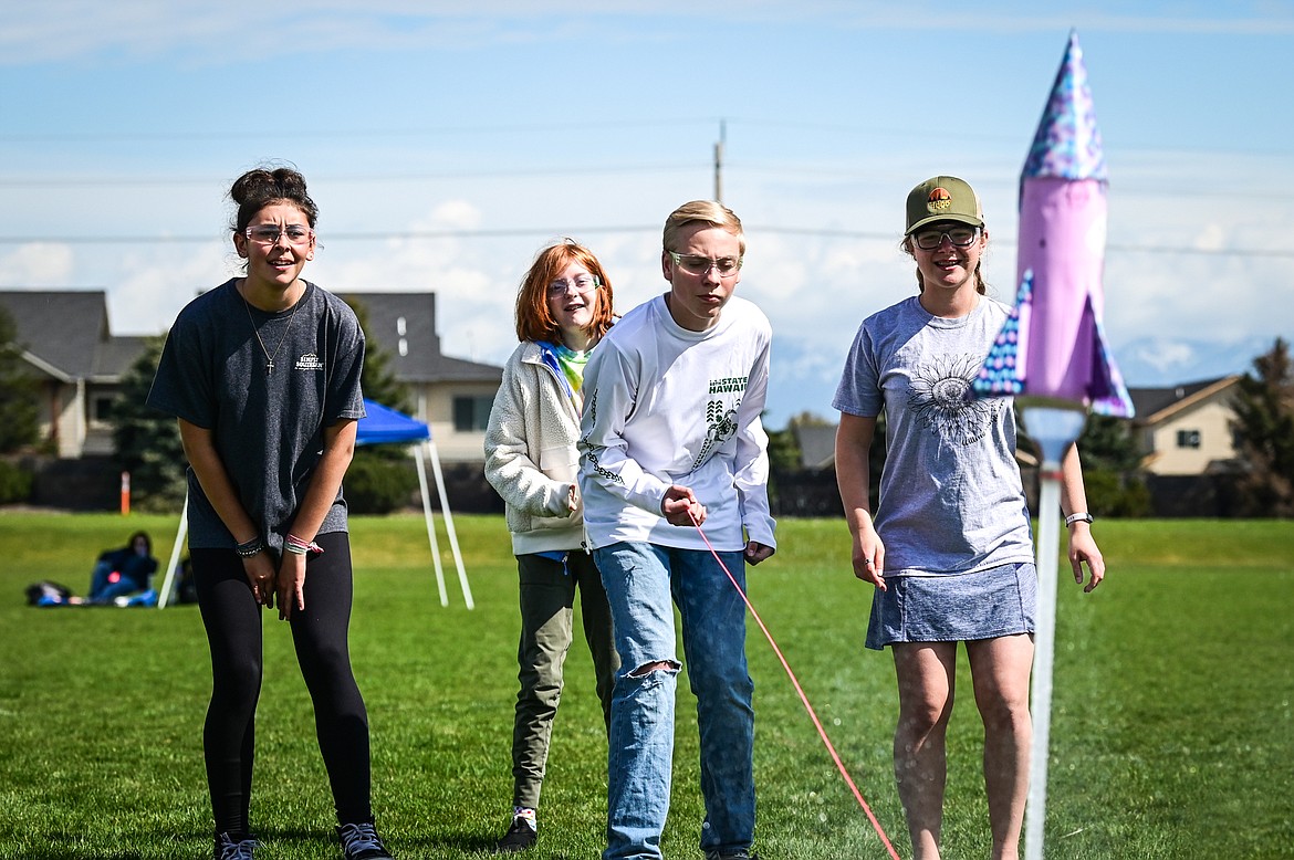 From left, Kalispell Middle School eighth-graders Jazmin Smith, Audrey Koontz, Nolan Shiesl and Abby Bailey launch their water-powered rocket named Bravery at the 6th annual Flathead Valley Rocket Rally at Glacier High School on Thursday, May 26. Students first learn the physics of flight and rocket science, then work in teams using the engineering process to design, build, test, analyze and modify their water bottle rockets. (Casey Kreider/Daily Inter Lake)