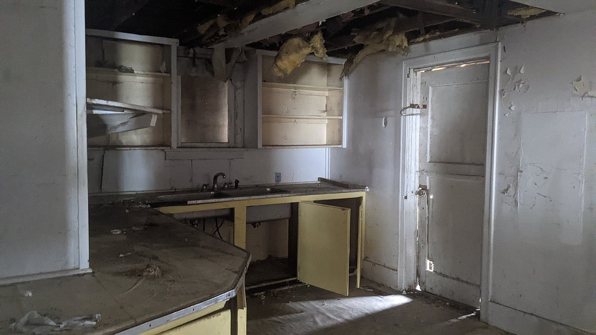 The kitchen section inside of the structure shows massive disrepair