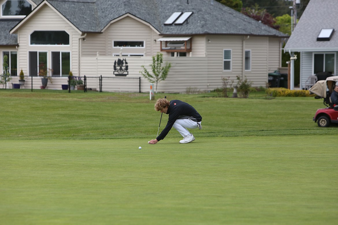 Ephrata’s Max Hewitt lines up a shot on the ninth hole at Capitol City Golf Club in Olympia at the 2A state tournament on May 24.