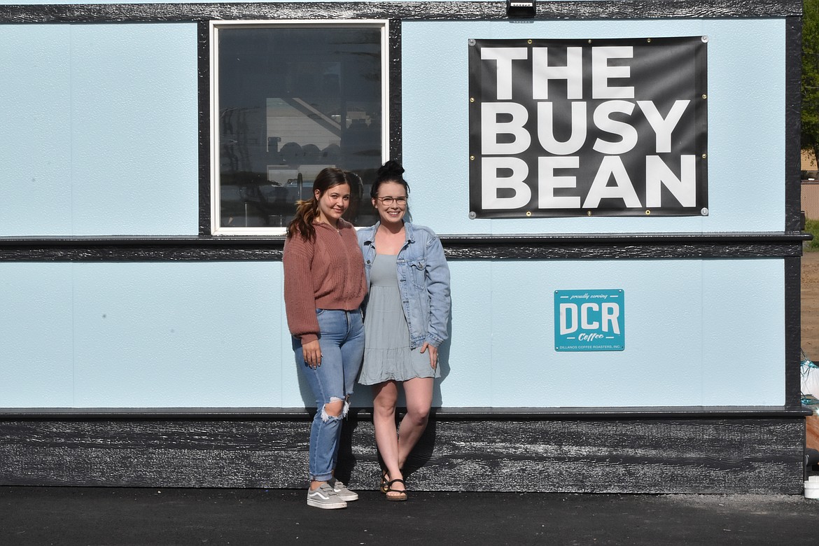 Kristina McCrady and Kenzie Balentine stand outside The Busy Bean’s new location.