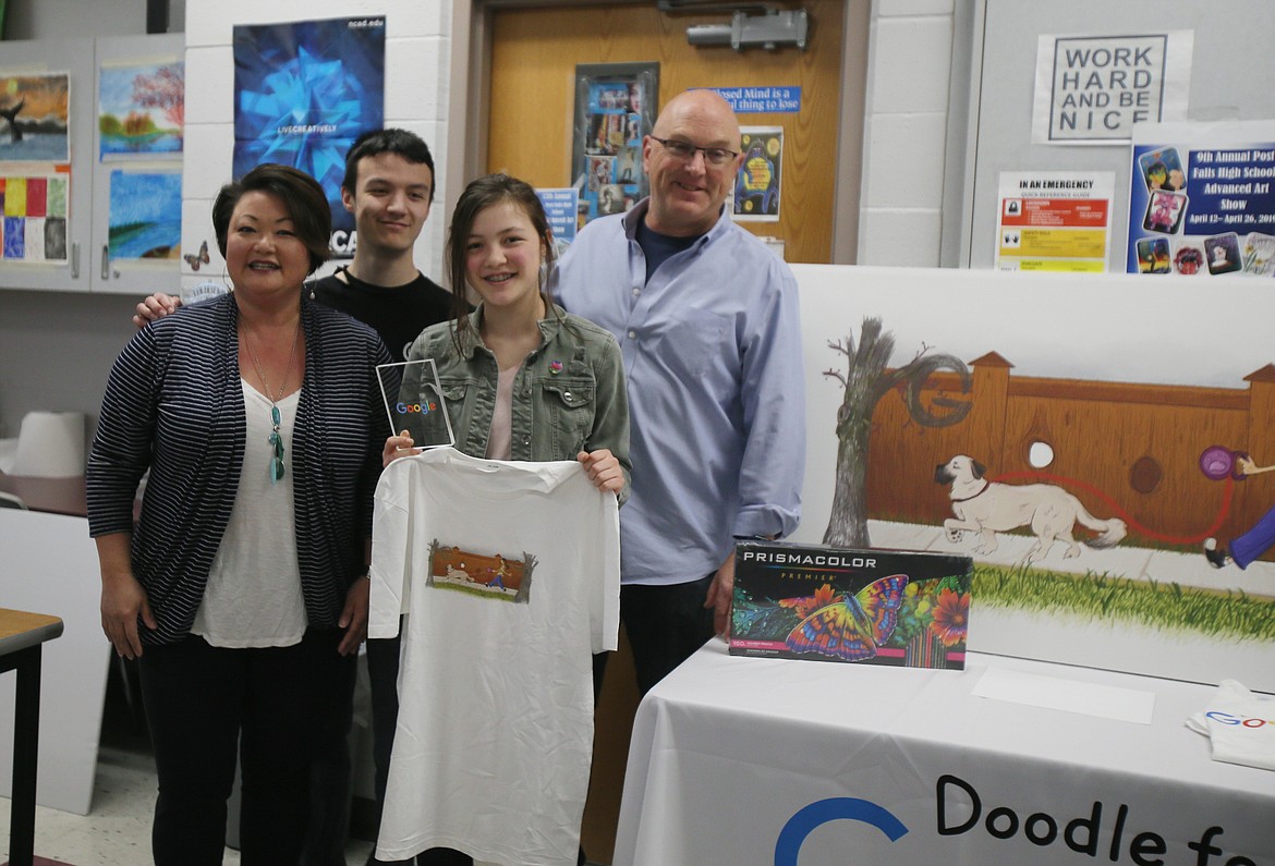 Idaho's Doodle for Google Student Contest winner Kaylin O'Halloran holds a T-shirt with her winning artwork Thursday morning while joined by mom Mandy, brother Keagan and dad Pat.