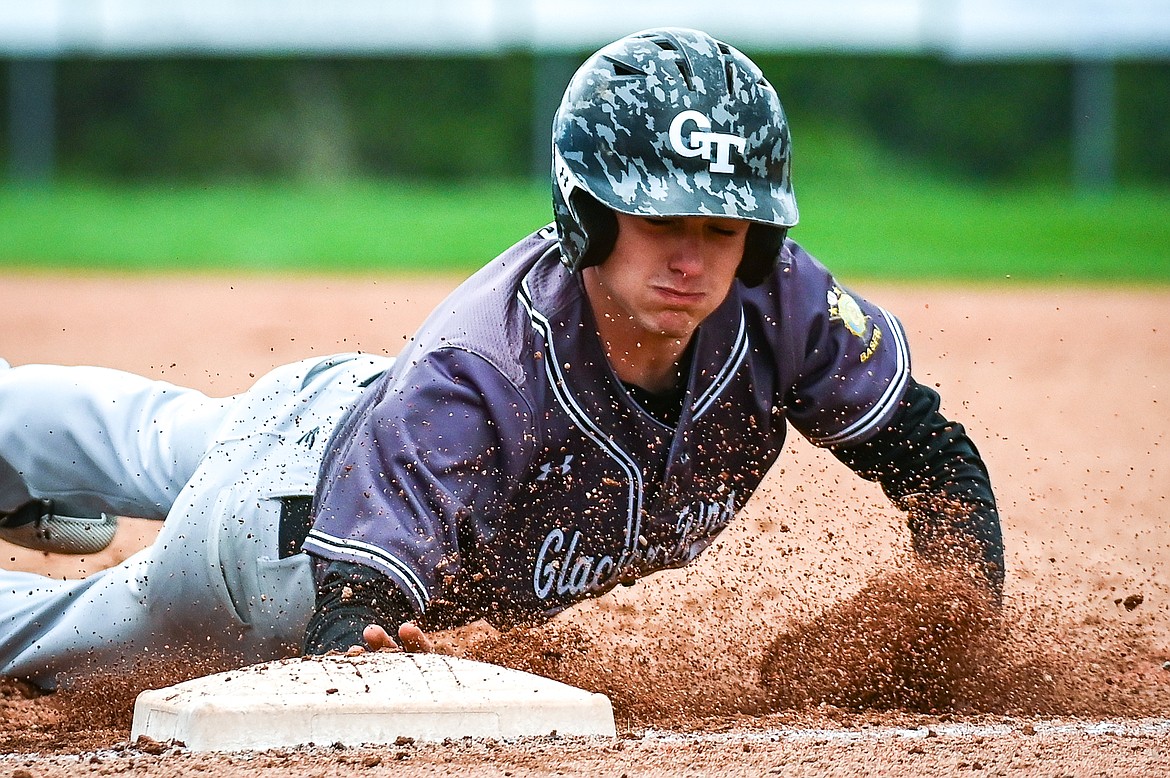 Glacier Twins' Kellen Kroger (7) dives back into first base after a pick off attempt against the Kalispell Lakers AA at Griffin Field on Friday, May 27. (Casey Kreider/Daily Inter Lake)