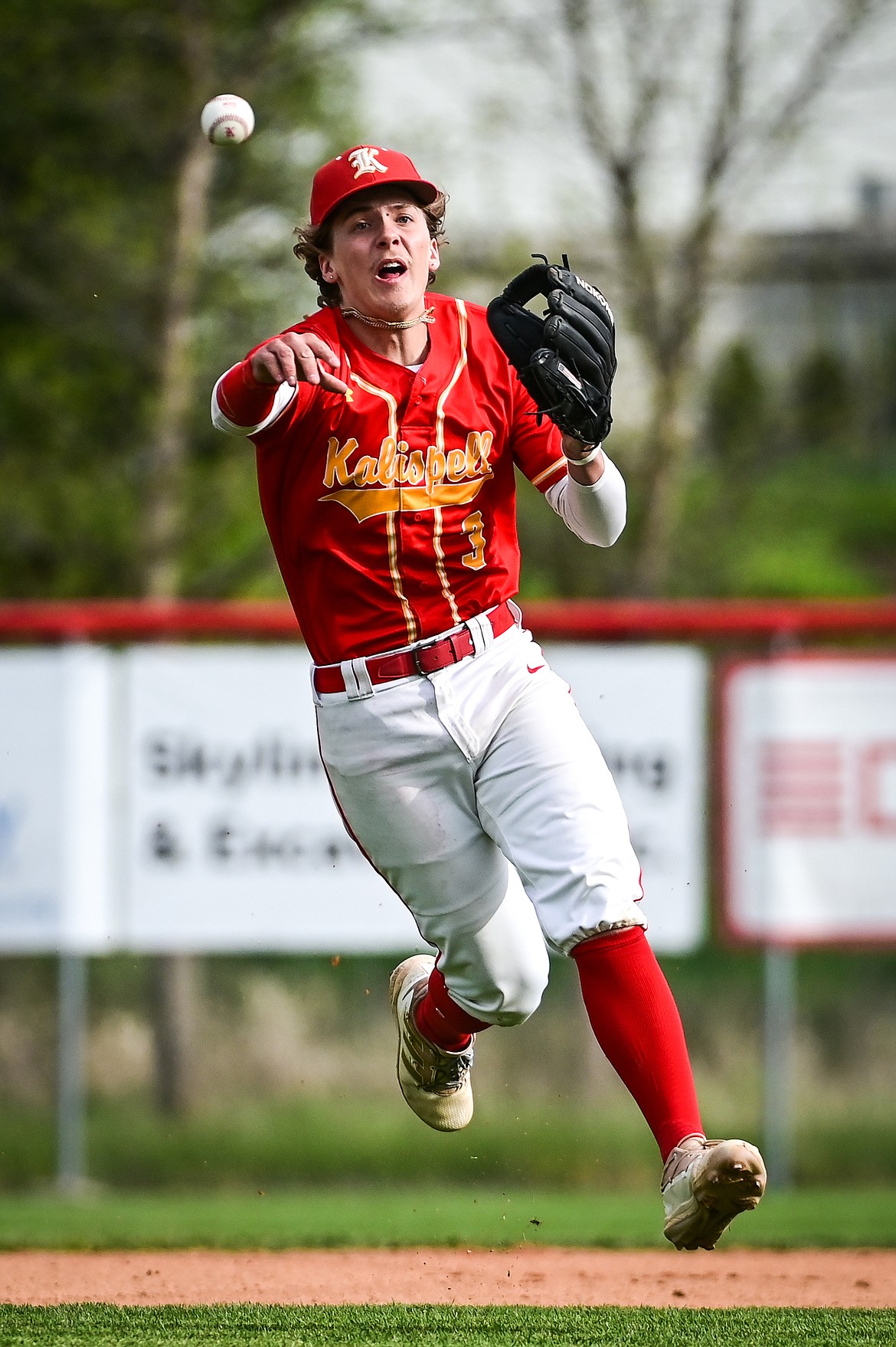 Kalispell Lakers AA shortstop Gage Brink (3) fires across the diamond for an out in the first inning against the Glacier Twins at Griffin Field on Friday, May 27. (Casey Kreider/Daily Inter Lake)