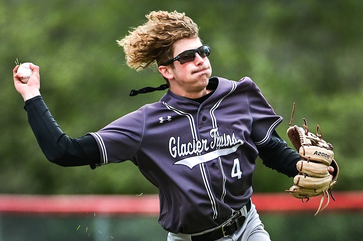 Glacier Twins third baseman Hayden Meehan (4) charges after a bunt but holds on to the throw against the Kalispell Lakers AA at Griffin Field on Friday, May 27. (Casey Kreider/Daily Inter Lake)