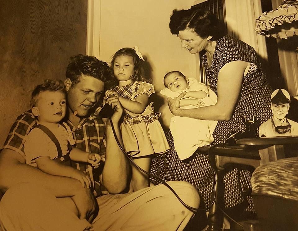 Courtesy photo
From left, Troy Ruttman Jr., Jerry Ruttman (Troy's brother), Toddy Ruttman, baby Roxanne and Mae Brinkley (Beverly's mom) gather around for a phone call from Troy after he won the Indy 500 in 1952.