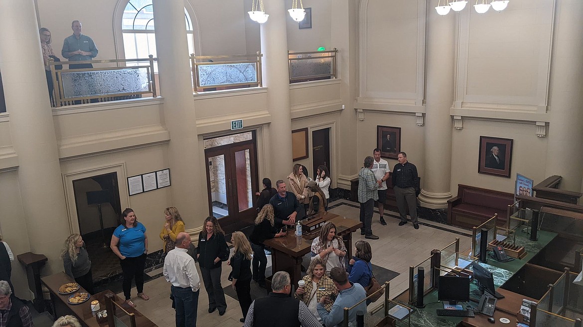 Members of the community and staff of Mountain West Bank gather to tour the century-old building.