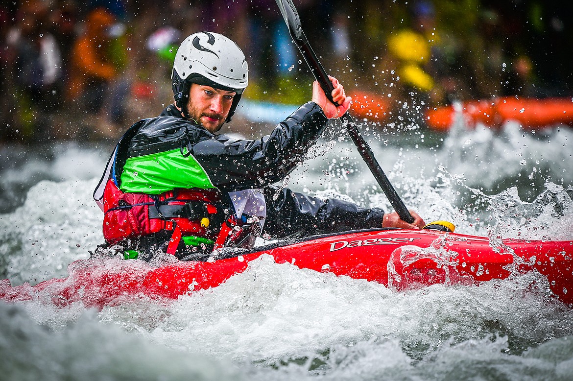 A kayaker navigates a section of the Wild Mile along the Swan River during the Expert Slalom event at the 47th annual Bigfork Whitewater Festival on Saturday, May 28. (Casey Kreider/Daily Inter Lake)