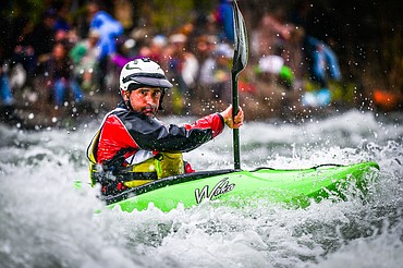 A kayaker navigates a section of the Wild Mile along the Swan River during the Expert Slalom event at the 47th annual Bigfork Whitewater Festival on Saturday, May 28. (Casey Kreider/Daily Inter Lake)