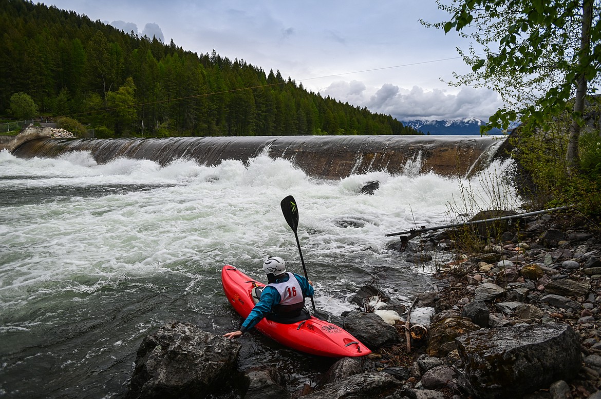 A kayaker puts-in below the dam before the start of the Expert Slalom at the Bigfork Whitewater Festival on Saturday, May 28. (Casey Kreider/Daily Inter Lake)