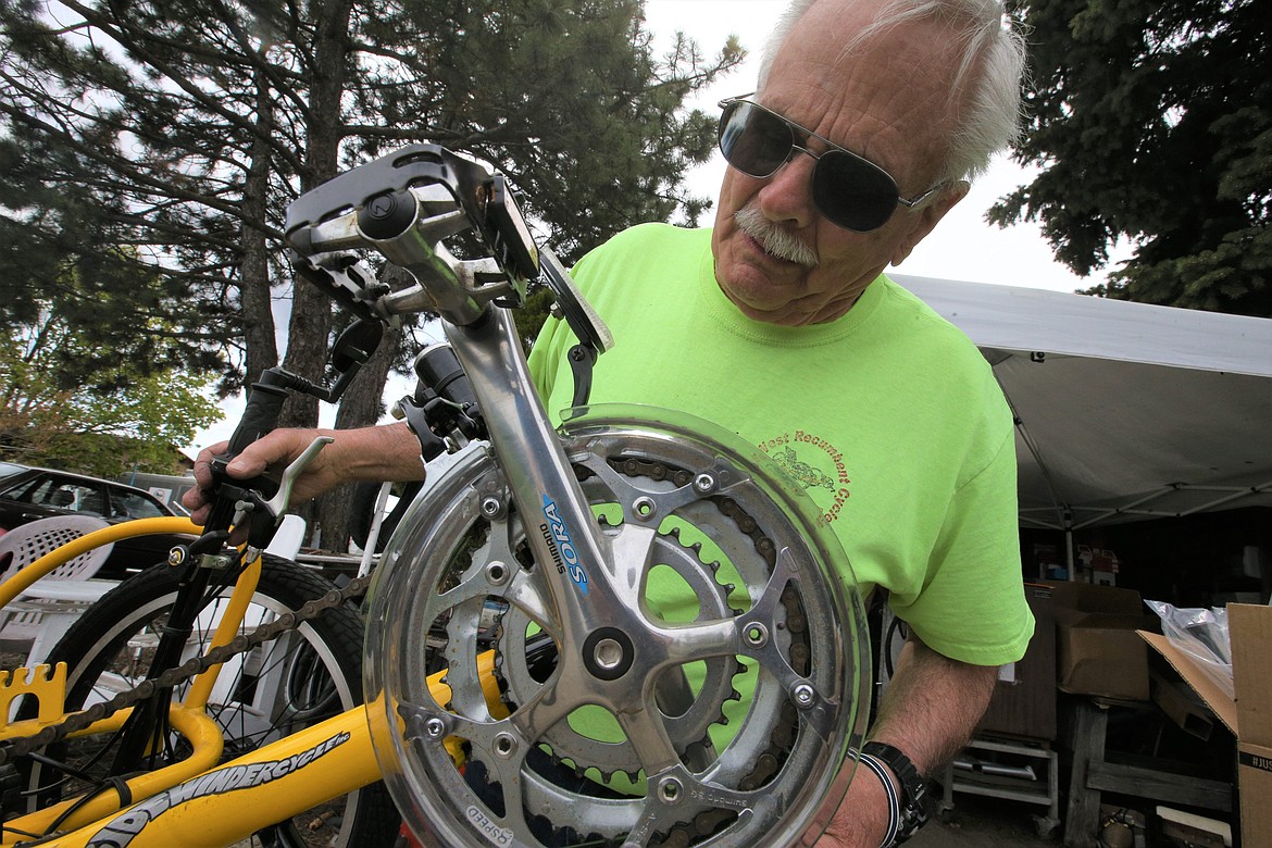 Gary Dagastine repairs a bike at his Post Falls home.