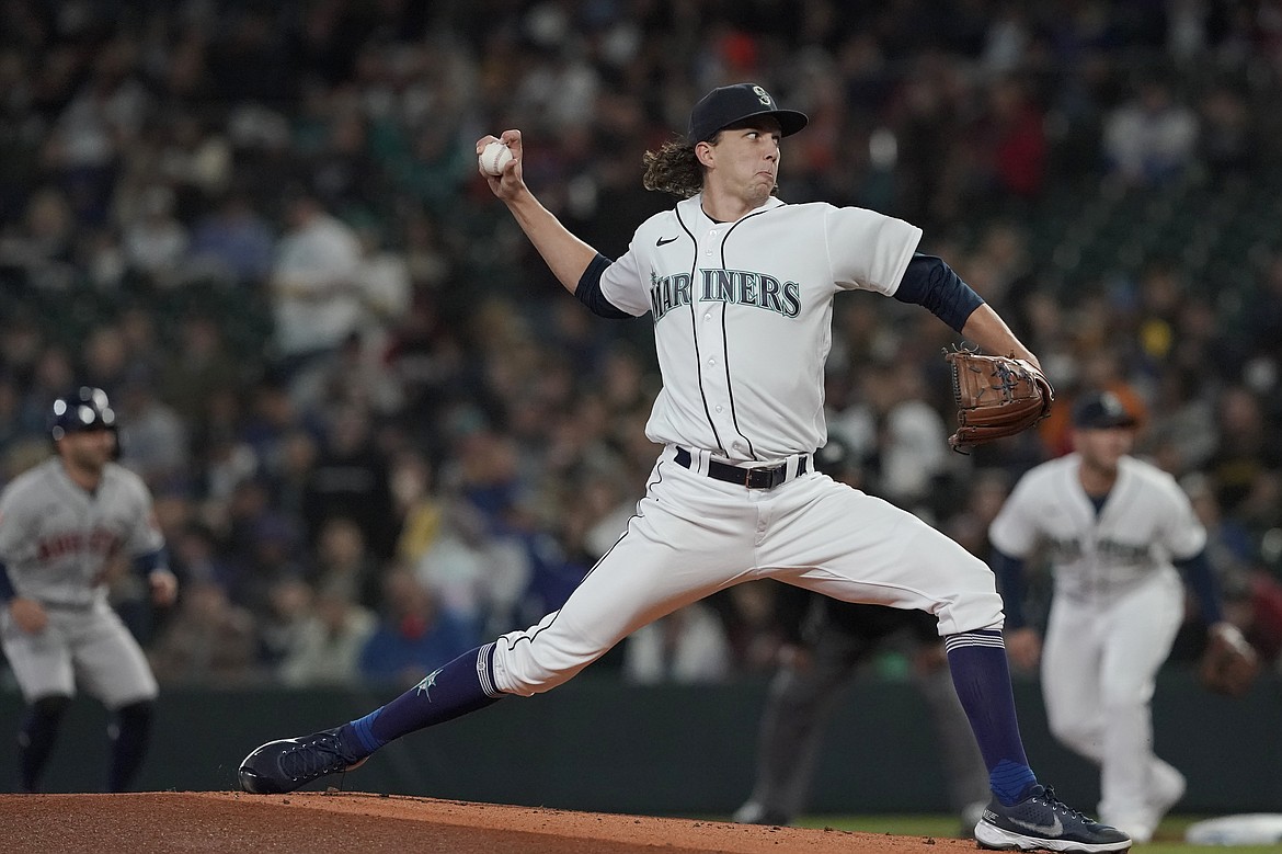 Seattle Mariners starting pitcher Logan Gilbert throws against the Houston Astros during the first inning of a baseball game, Saturday, May 28, 2022, in Seattle.