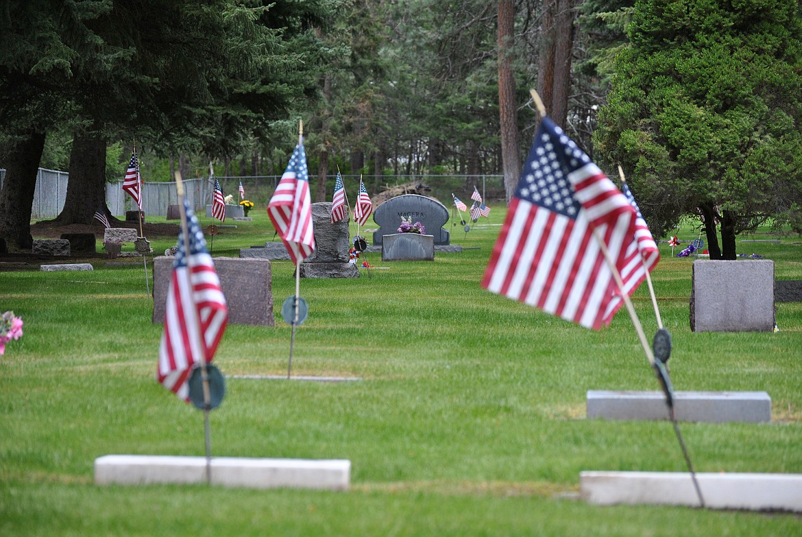 There were well over fifty American flags placed at various graves in the St. Regis Cemetery this Memorial Day weekend, just a small representation of the very large percentage of service members that make up all of Mineral County. Miniature versions of the stars and stripes waving around the green lawns are a visual reminder to all Montana communities of their own veterans buried and the ultimate sacrifice that many have made. (Amy Quinlivan/Mineral Independent)