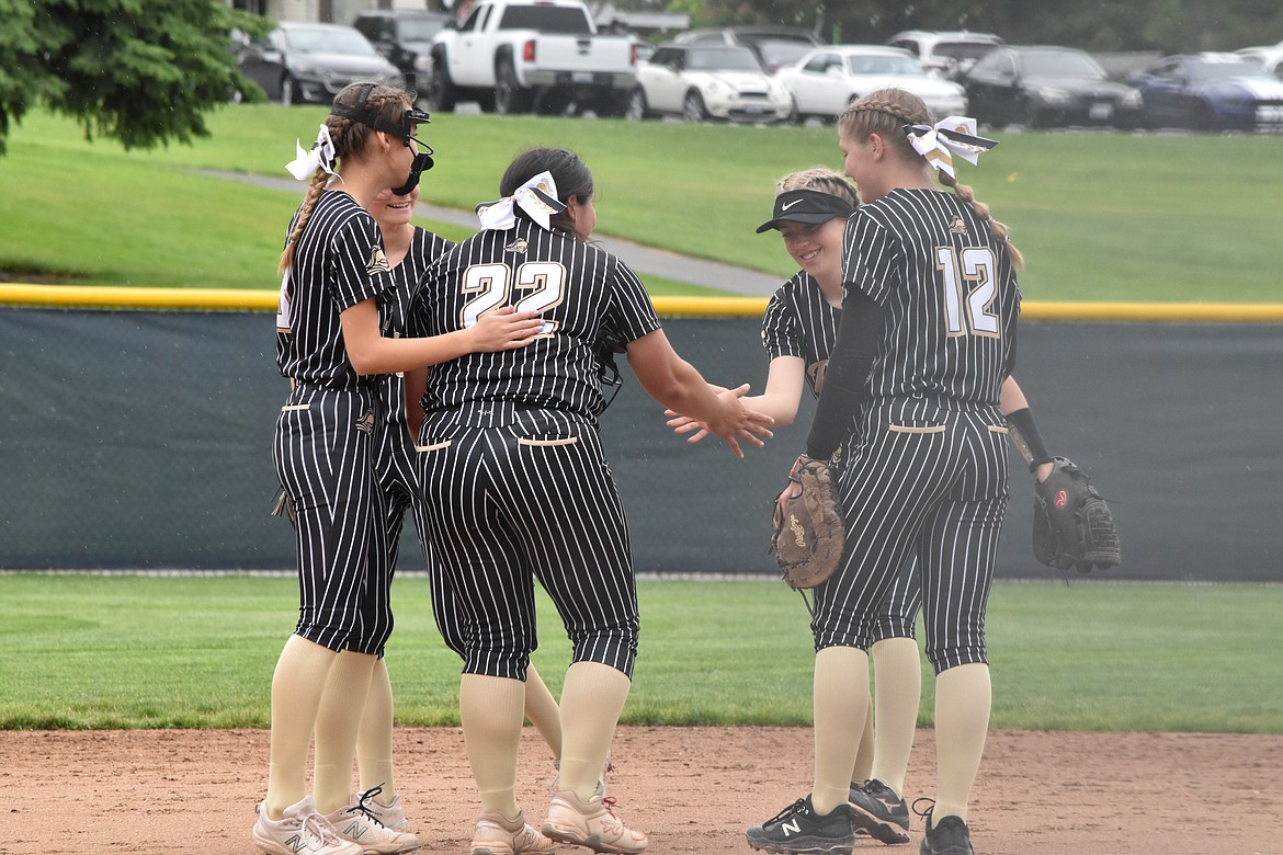 Royal players celebrate after a great play. Despite losing in the first round at state, the Lady Knights grew as a team this season and coach Lisa Lawrence said she is very proud of their efforts.
