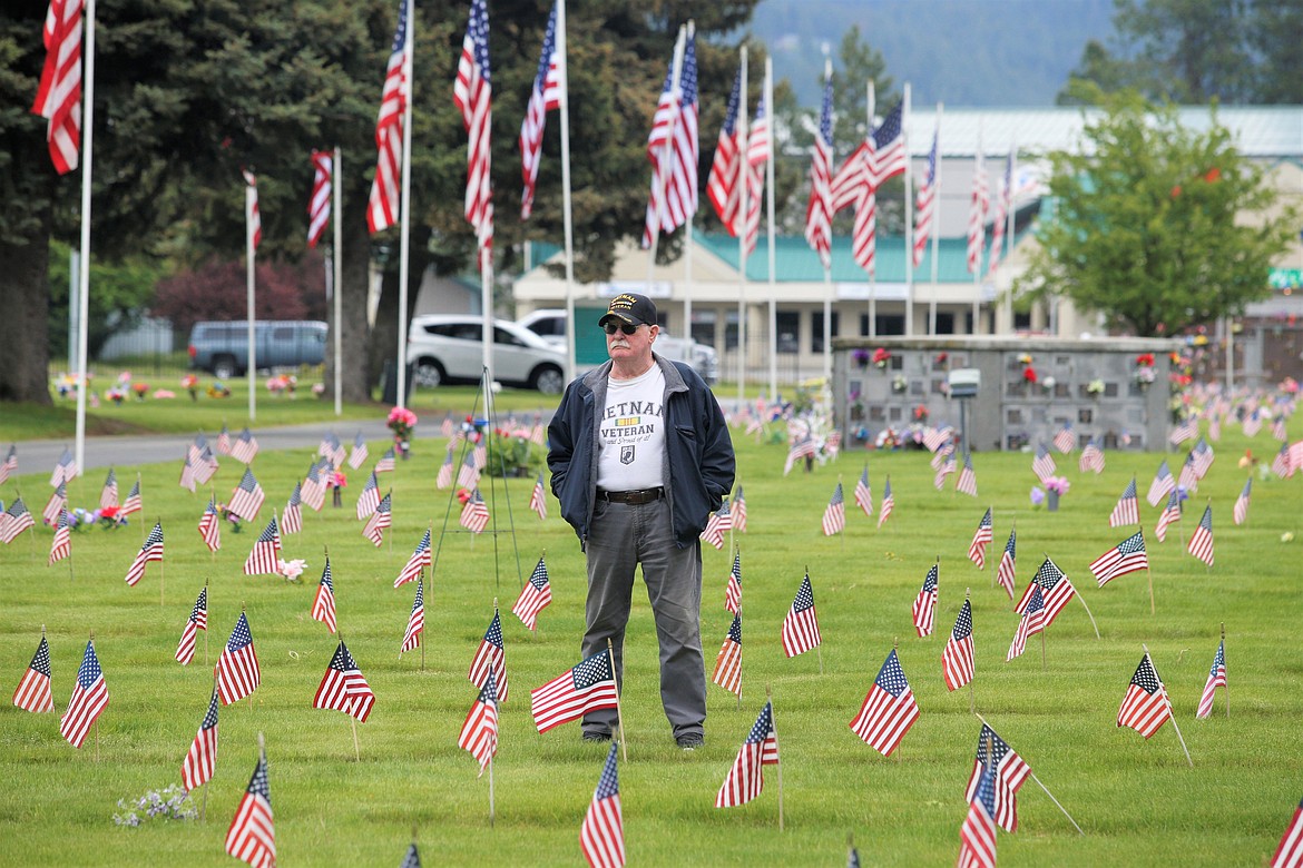 Don Lindberg of Hayden, a Vietnam War veteran, stands and listens during the Memorial Day ceremony at Coeur d'Alene Memorial Gardens.