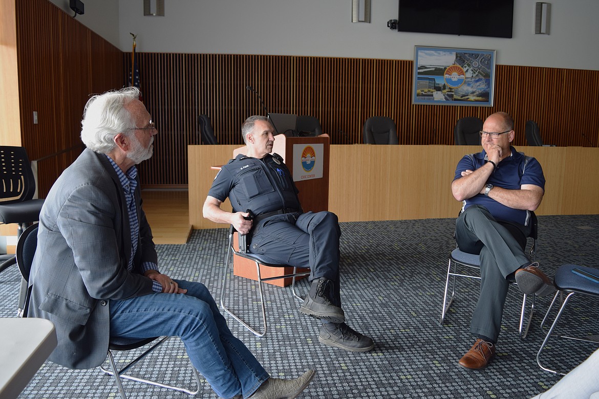 Rep. Dan Newhouse, R-Yakima, left, meets with Moses Lake Police Chief Kevin Fuhr, center, and Ephrata Police Chief Kurt Adkinson, right, in the city council chambers of the Moses Lake Civic Center on Friday. Newhouse was in Moses Lake on Friday to visit industries at the Port of Moses Lake and talk with police chiefs as part of his regular work representing Washington’s 4th Congressional district.