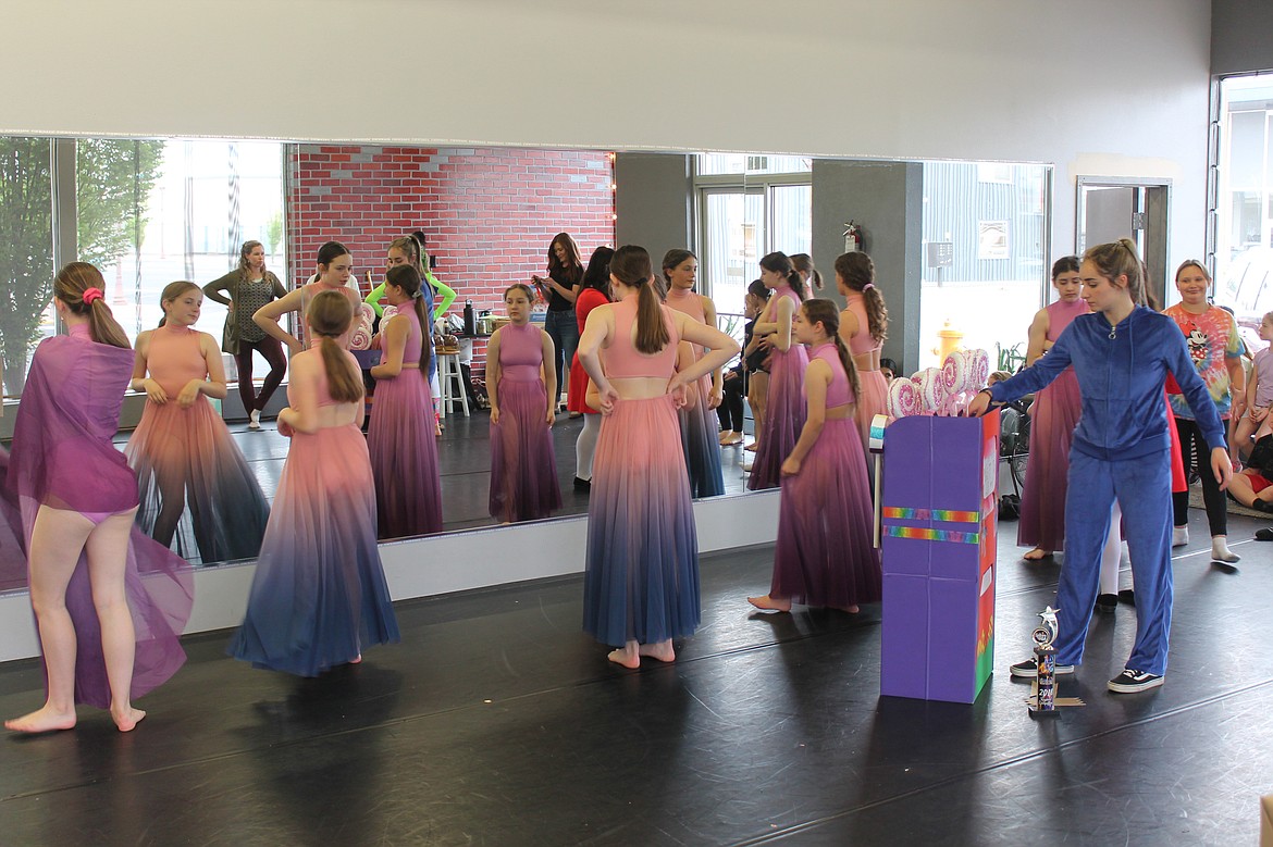 Esther Roeber, right, as Violet Beauregarde and dancers representing Pure Imagination rehearse Friday for “Willy Wonka.”