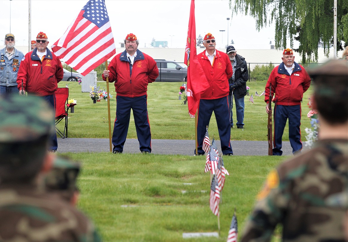 Veterans, from left, Bill Maroney, Dennis Dodd, Darrell Mayer and Tom Wambolt participate in the Memorial Day ceremony at Coeur d'Alene Memorial Gardens.