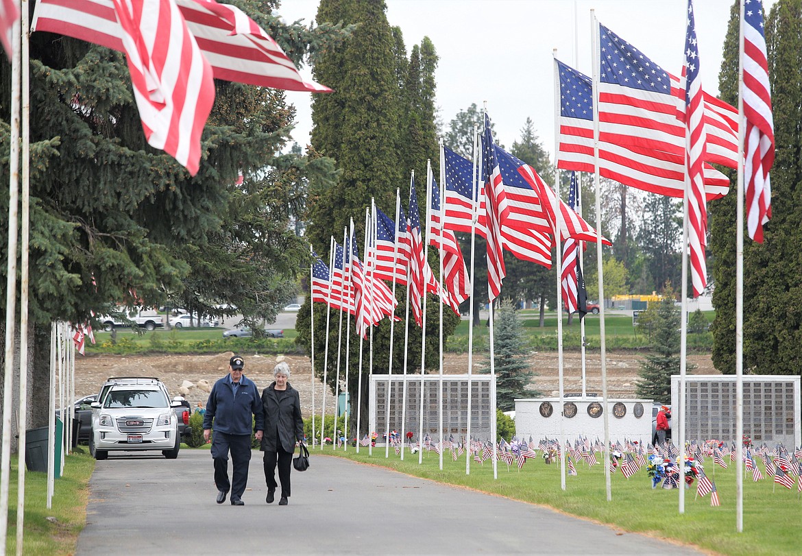 Cloyd and Kathy Potter walk away from Coeur d'Alene Memorial Gardens following Monday's ceremonies.