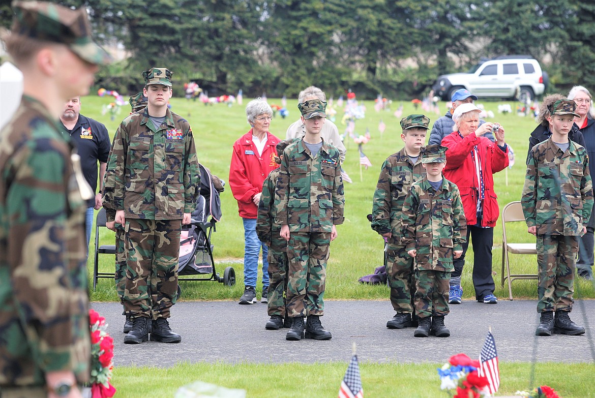 Young Marines take part in the Memorial Day ceremony at Coeur d'Alene Memorial Gardens. From left, Bruce Connelley (foreground), Blaise Dubois, Daymian Reese, Jayce Olenslager and Nathan Holt.