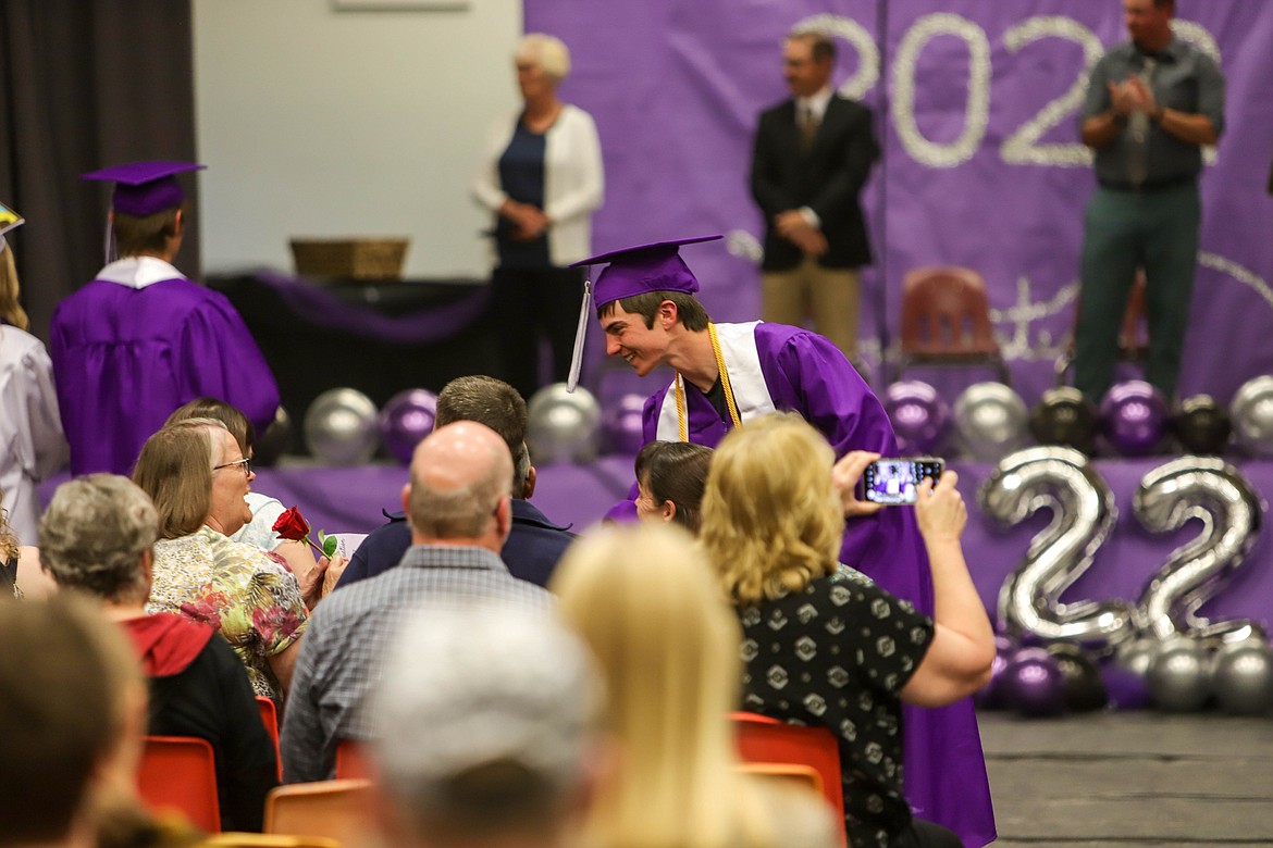 Coyle Nagy gives his family a flower at the Charlo High School graduation on May 29, 2022. (JP Edge/Hungry Horse News)