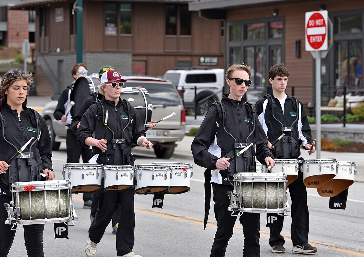 The Whitefish High School drumline makes its way down Second Street as part of the Memorial Day Parade on Monday. (Whitney England/Whitefish Pilot)