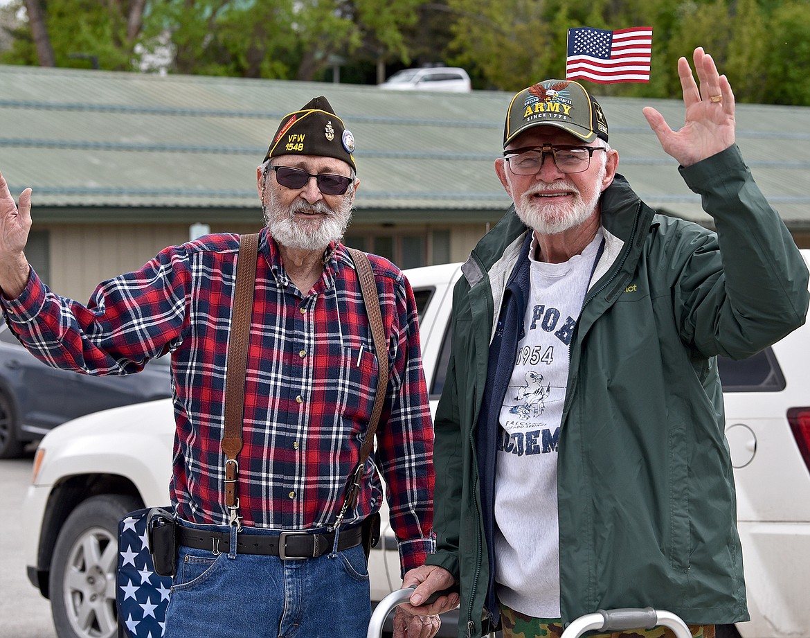 A U.S. Navy veteran and a U.S Army veteran came together to watch the Memorial Day Parade in Whitefish on Monday afternoon. (Whitney England/Whitefish Pilot)