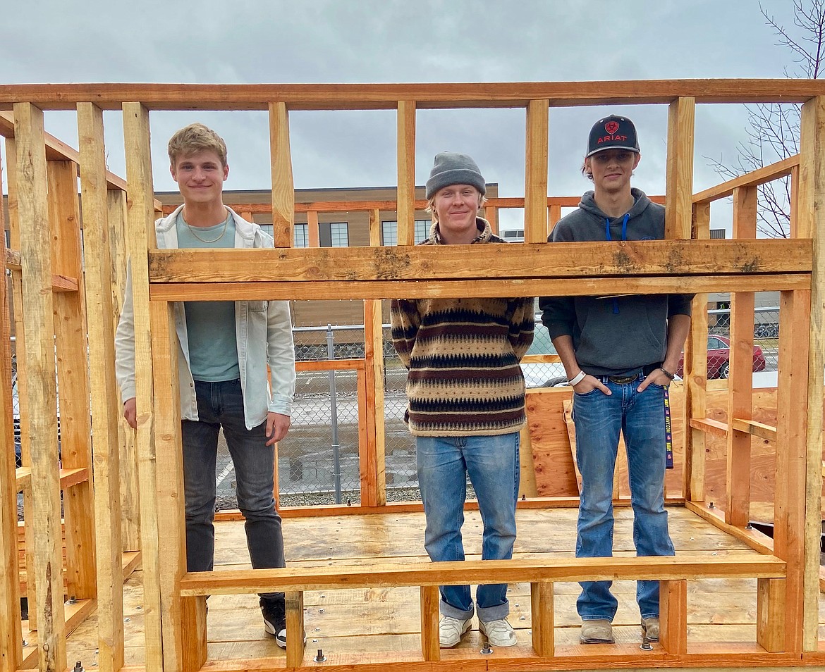 Whitefish High School students Kenna Ferril, Niko Hunter and Landon Peacock with a building project as part of the regenerative agriculture program. (Courtesy photo)