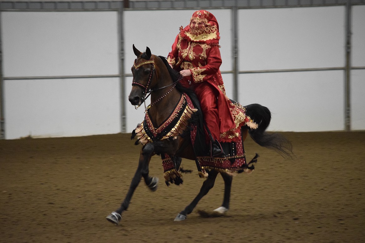 Carol Rasmussen shows off her riding skills in the Ardell Pavilion at the Grant County Fairgrounds during the Inland Empire Arabian Horse Club’s annual Memorial Day Classic horse show.