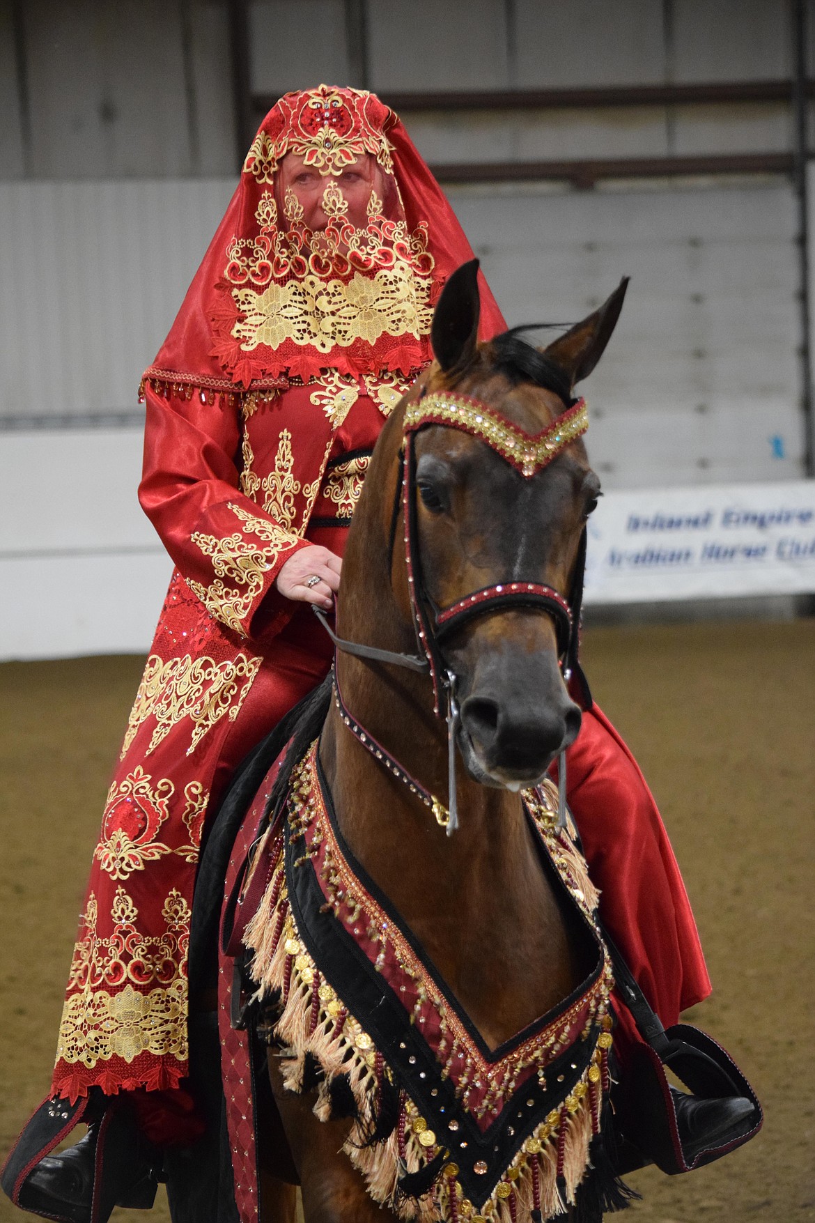 Carol Rasmussen shows off her riding skills in the Ardell Pavilion at the Grant County Fairgrounds during the Inland Empire Arabian Horse Club’s annual Memorial Day Classic horse show.