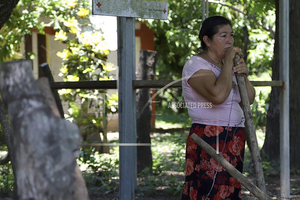 Maria Dolores Garcia, the mother of Esmeralda Dominguez, looks out at the plants dying in her daughter’s unattended garden, in the Sisiguayo community in Jiquilisco, in the Bajo Lempa region of El Salvador, Thursday, May 12, 2022. Her daughter is among thousands arrested since the congress granted President Nayib Bukele a state of emergency declaration suspending civil liberties after street gangs killed dozens of people in late March. (AP Photo/Salvador Melendez)