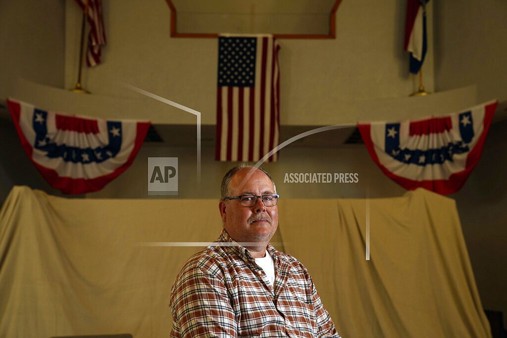 Mayor Willie Richter poses for a photo inside city hall Friday, May 27, 2022, in West Alton, Mo. The small city at the confluence of the Mississippi and Missouri rivers turned down a potential $106,341 of federal coronavirus aid. The rejected amount was almost half the size of the city's budget. From small towns to big cities, every government across the U.S. was offered a slice of $350 billion of federal coronavirus relief funds to help shore up their finances, cover pandemic-related costs and invest in community projects. (AP Photo/Jeff Roberson)