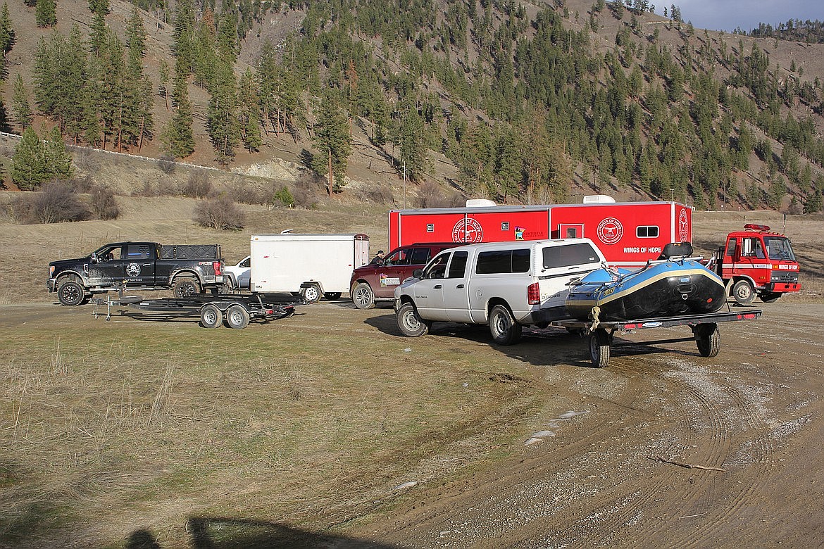 Search and rescue teams park near the Clark Fork River in Mineral County during the search effort for a woman who went missing in July 2021. (Mineral Independent FILE)