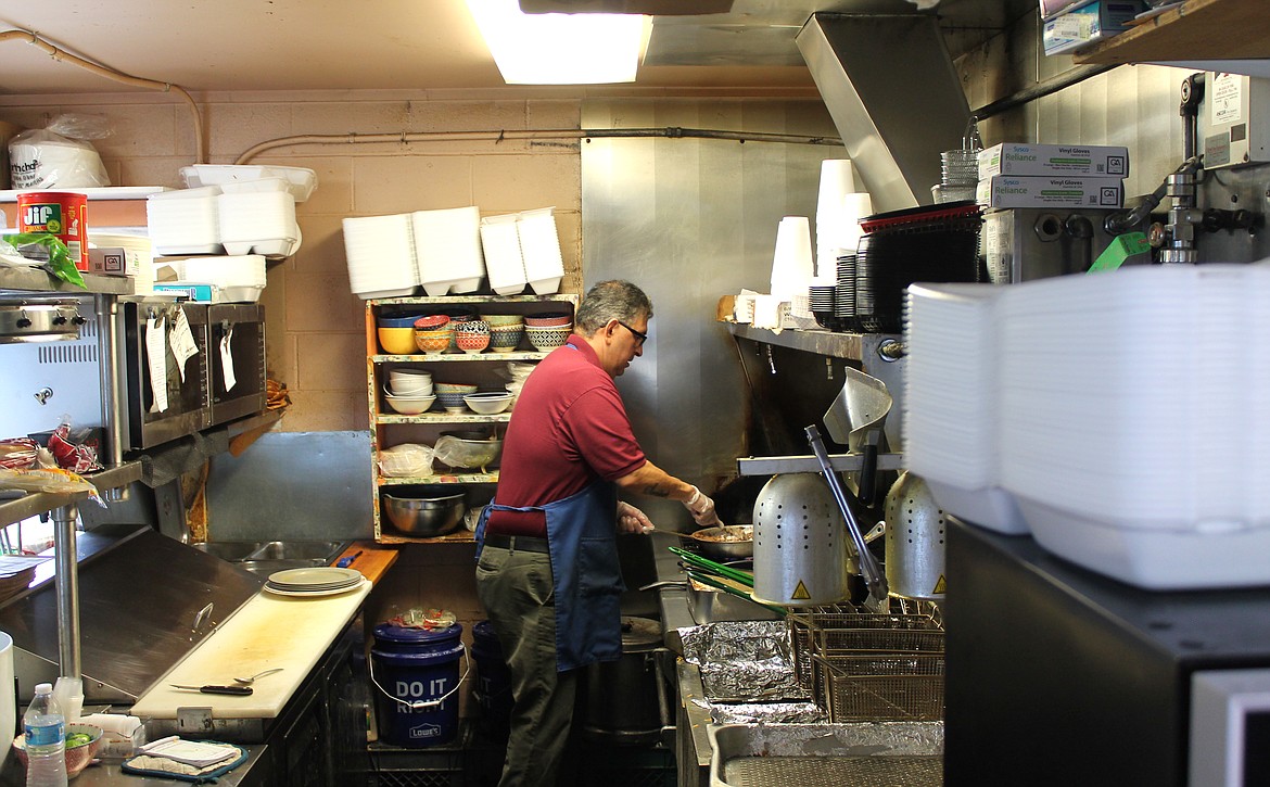 Pete Gonzalez gets started in The Taco Shop’s kitchen Friday morning. Gonzalez sticks closely to the same recipes his father, Fred Gonzalez, used when he opened the shop in 1977.