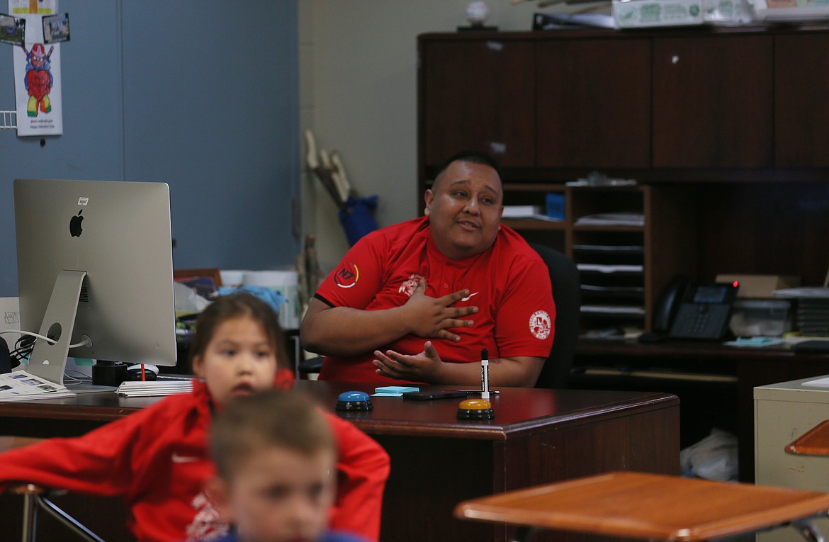 Coeur d'Alene Tribal School teacher James LaSarte-Whistocken introduces himself in traditional Coeur d'Alene language to visitors from the U.S. Department of Education on Friday.