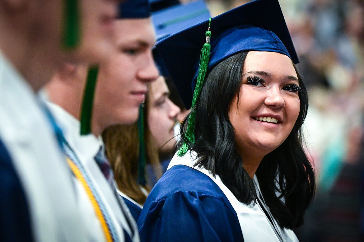 A graduate looks to the crowd and smiles at Glacier High School's Class of 2022 commencement ceremony on Saturday, June 4. (Casey Kreider/Daily Inter Lake)
