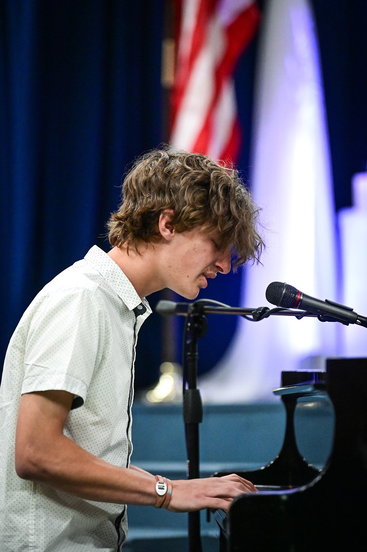 Graduate Josh Mortenson performs the song "Kids" by Ben Rector at Glacier High School's Class of 2022 commencement ceremony on Saturday, June 4. (Casey Kreider/Daily Inter Lake)