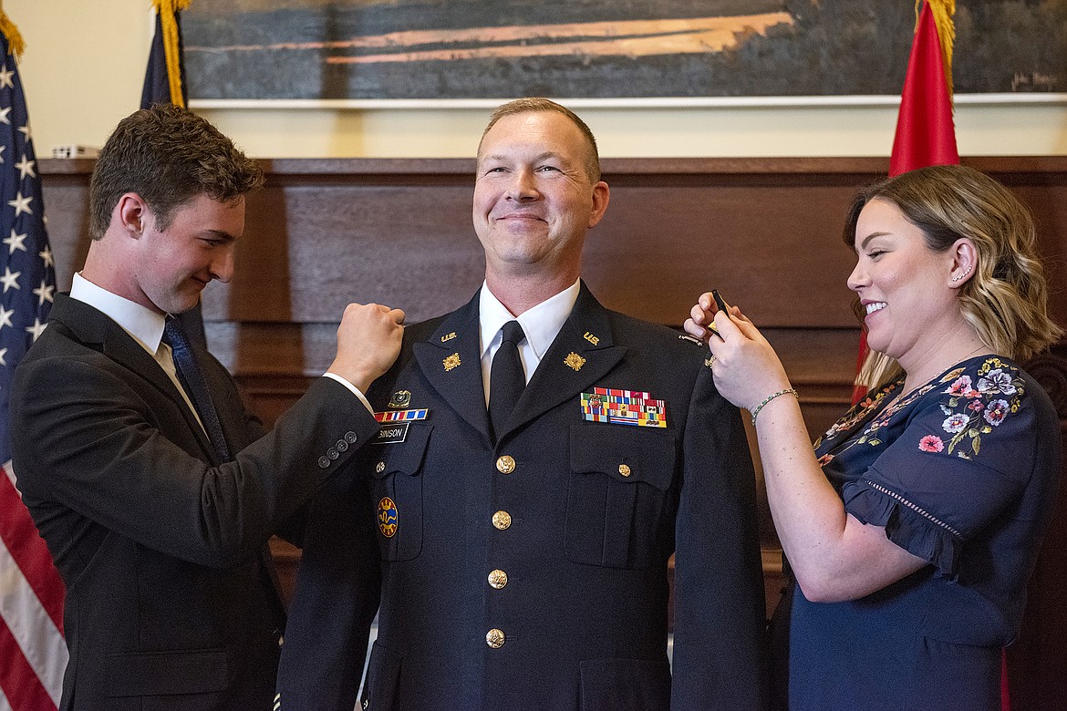 Son Ben and wife Cassie pin silver general officer stars to the shoulders of Brig. Gen. Ryan Robinson at the state capitol during a promotion ceremony Thursday, June 2, in Boise. Robinson, a resident of Sandpoint and member of the Idaho National Guard, will serve as the director of the joint staff for the Idaho Military Division.