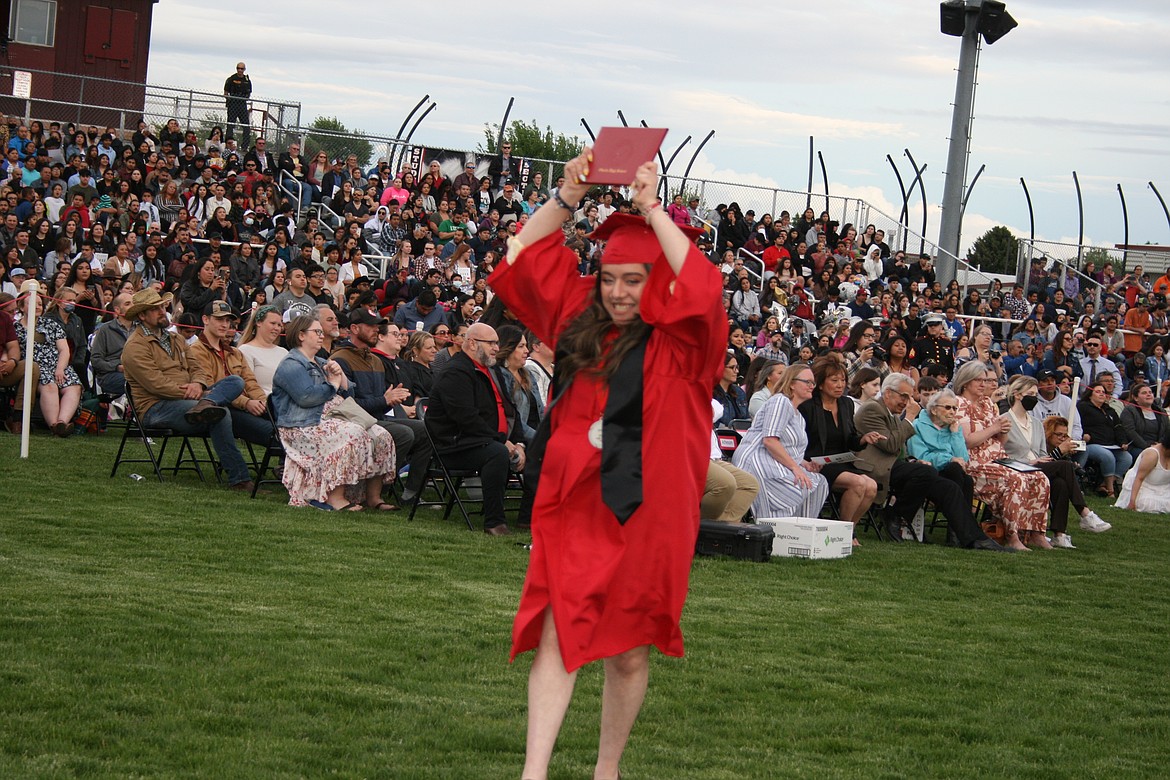 An Othello senior celebrates during Friday’s graduation ceremony.