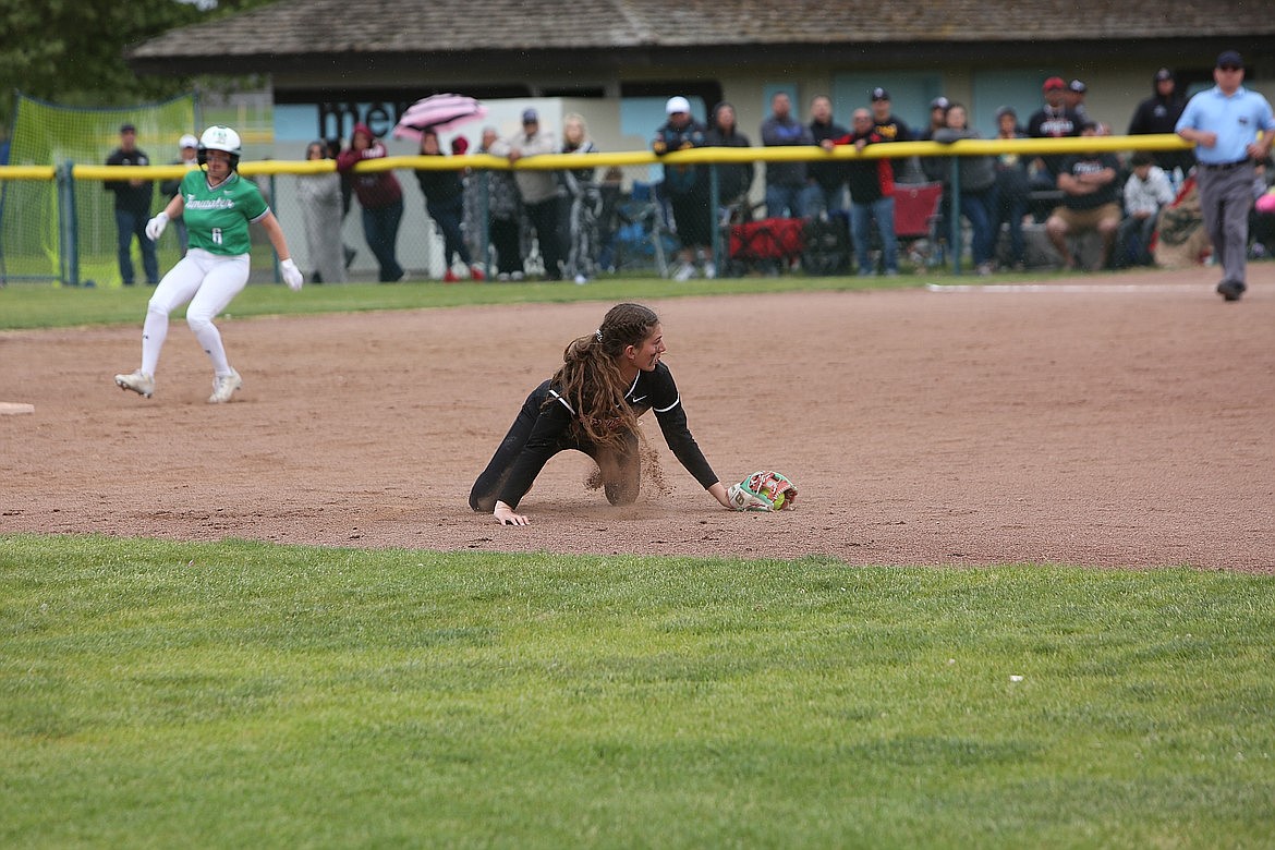 Othello shortstop Camryn McDonald dives after a ball in the infield during the 2A state championship game. McDonald was named the CWAC Most Valuable Player.