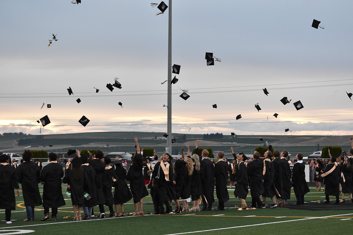 Before the Royal High School Class of 2022 left the field to reunite with their family, they gathered in a circle and threw their caps up in the air in celebration.