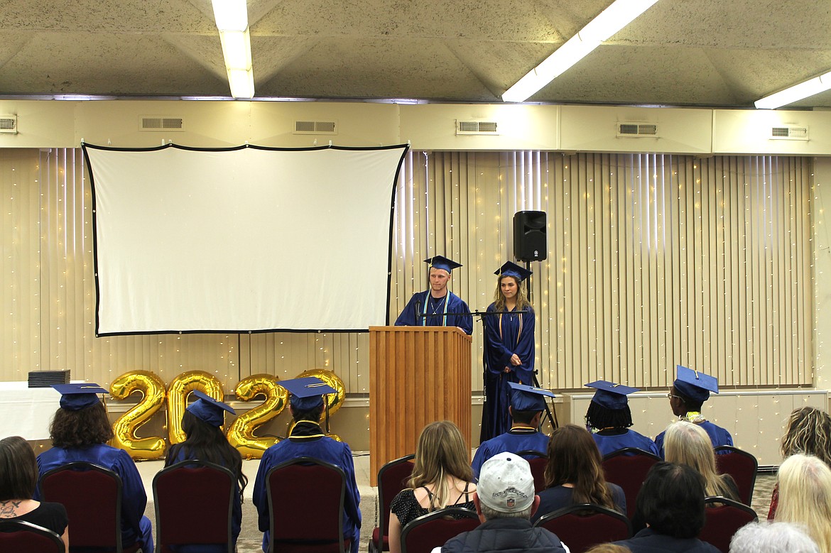 Jacob Robertson, left, and Kaylin Hampton deliver the Moses Lake Christian Academy’s class motto and verse at their graduation ceremony Saturday.