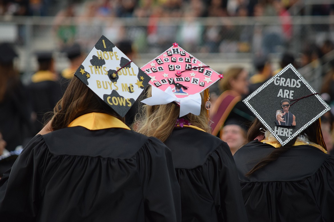 Messages on the mortar boards of several MLHS graduating seniors as they line up to receive their diplomas.