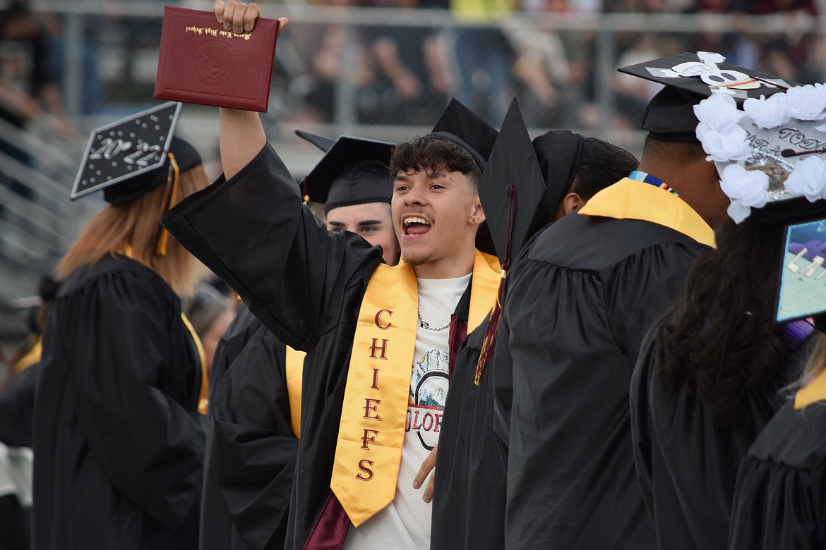 An MLHS graduate shows off his diploma at the school’s graduation ceremony on Friday. While this class may be the last to wear the Chiefs stole, it still was able to shine a light on many bright traditions and a history of excellence at Moses Lake High School regardless of the mascot representing the school.