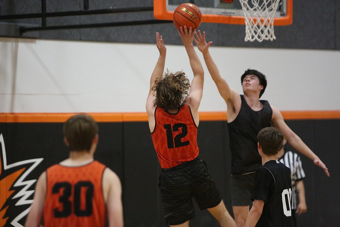 Ephrata’s Travis Hendrick shoots a turnaround jumper in the face of a Lake Roosevelt defender.