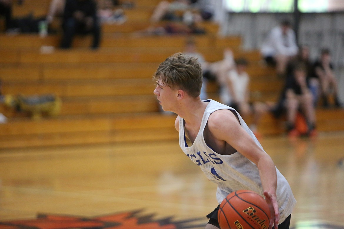 Andrey Sushik advances the ball upcourt in Soap Lake’s matchup against Eastmont.