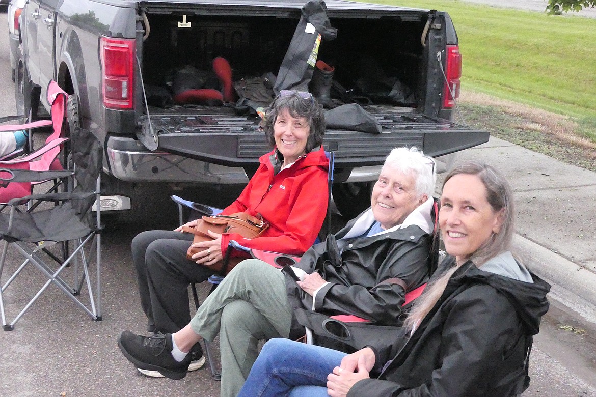 Plains residents Colleen McCarthy (left), Peggy McCarthy (center) and Erin McCarthy (right) get ready for the start of the Plains Day parade this past Saturday.  (Chuck Bandel/VP-MI)